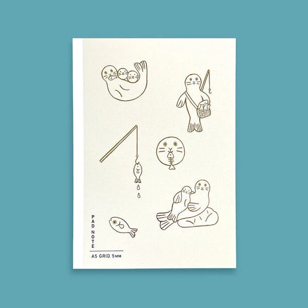 Sikigu white A5 notebook with line drawings of a seal family and fish