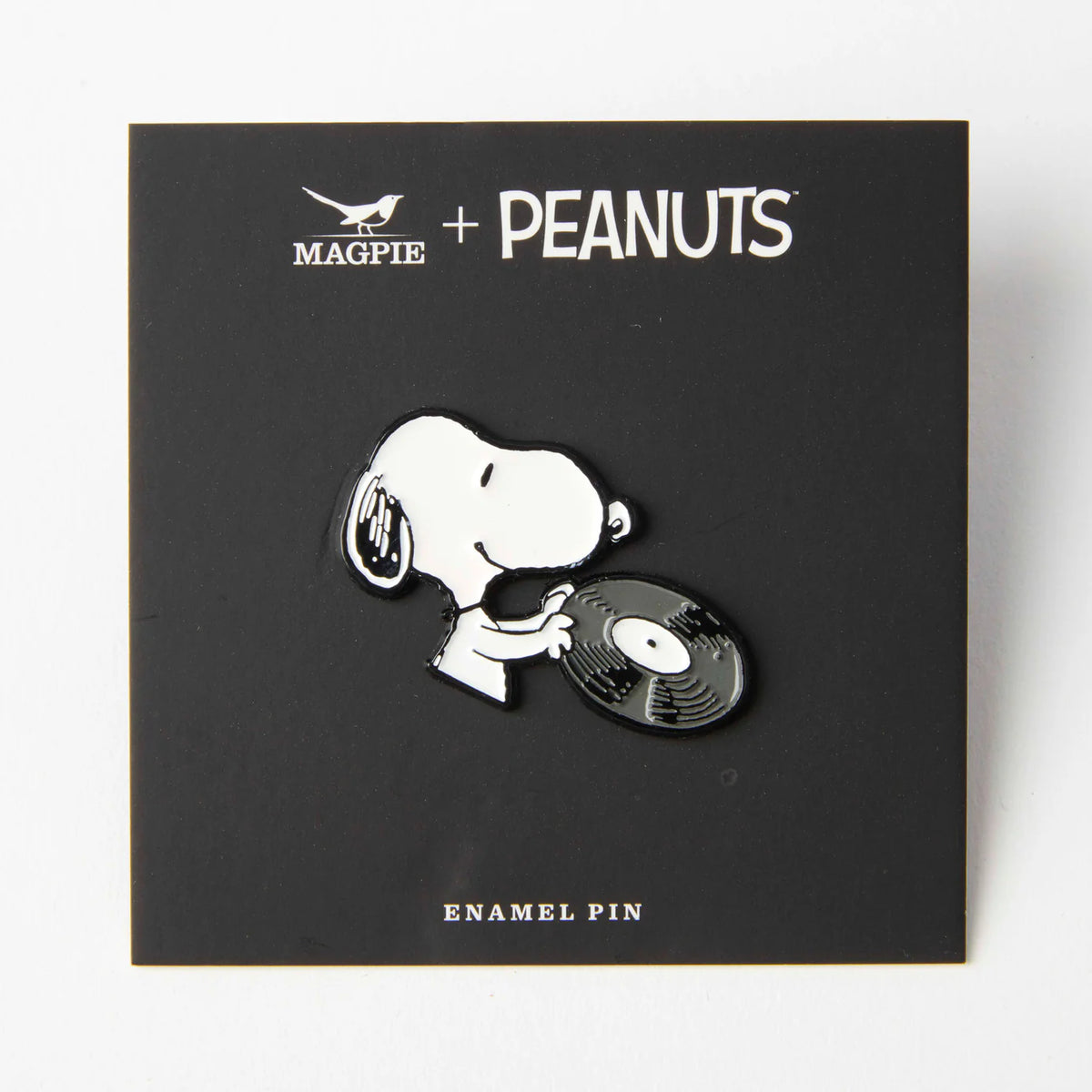 Snoopy record pin on its black Magpie x Peanuts card