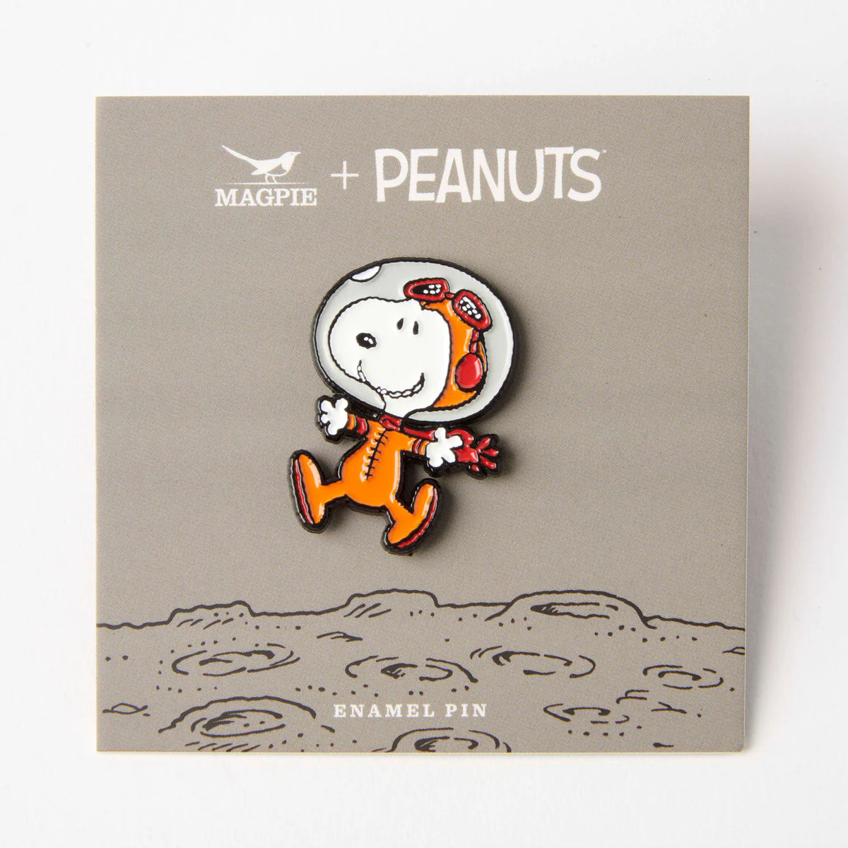 Astronaut Snoopy pin on its grey moon backing card