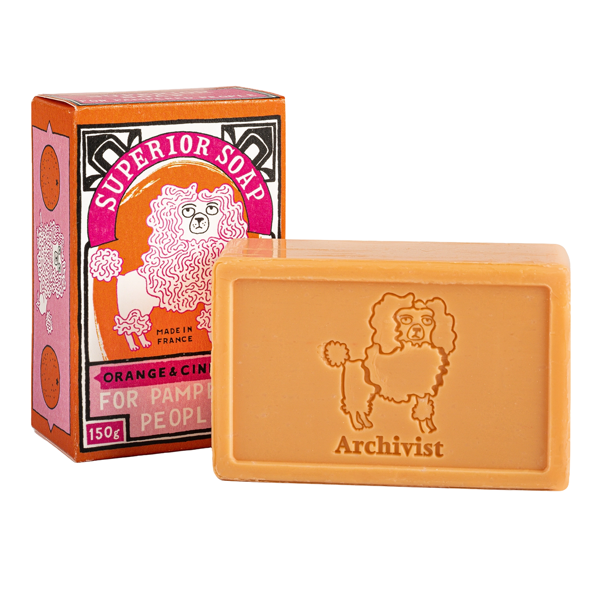 Orange and cinnamon soap bar stamped with a poodle beside its orange box