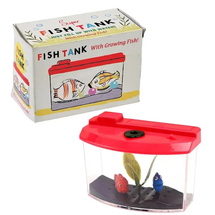 Rex fish tank toy: small clear plastic tank with a red lid, toy fish and plant, in front of its illustrated 'Super Fish Tank' box