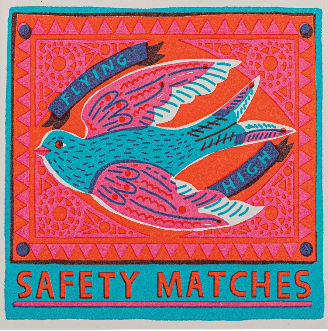 Archivist Flying High safety matches: a swallow with ribbon lettering on a coral background