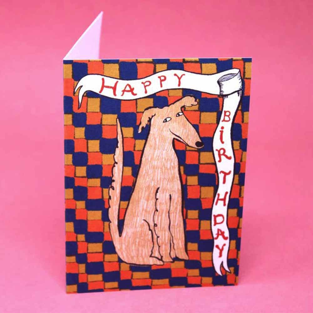 Card with a tan dog on an orange and navy checkerboard: Happy Birthday