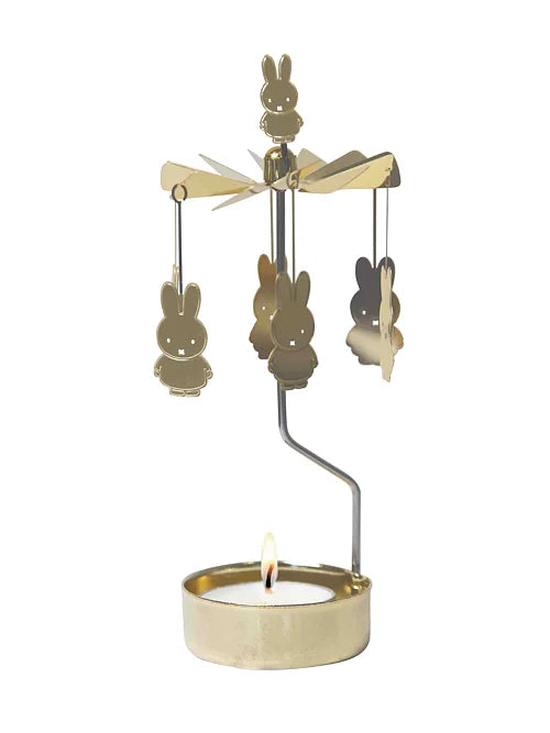 Gold Miffy angel chime with a lit tealight