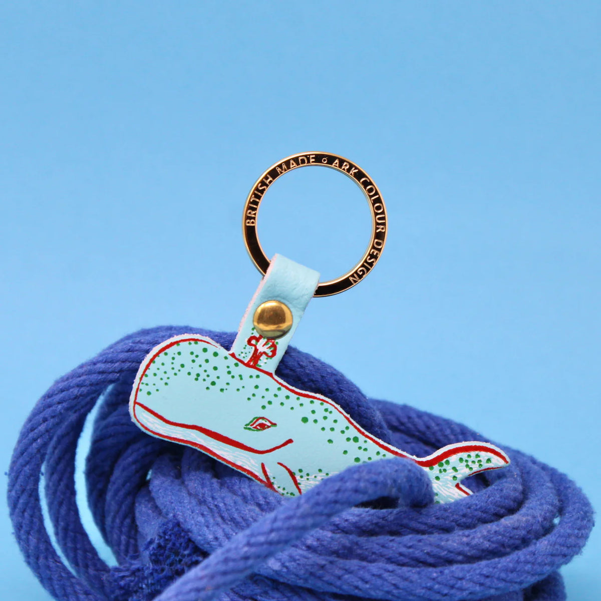 Ark turquoise humpback whale leather key fob among blue rope