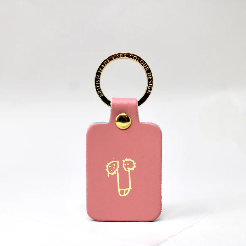 Ark pink leather key fob with a gold-printed cheeky doodle