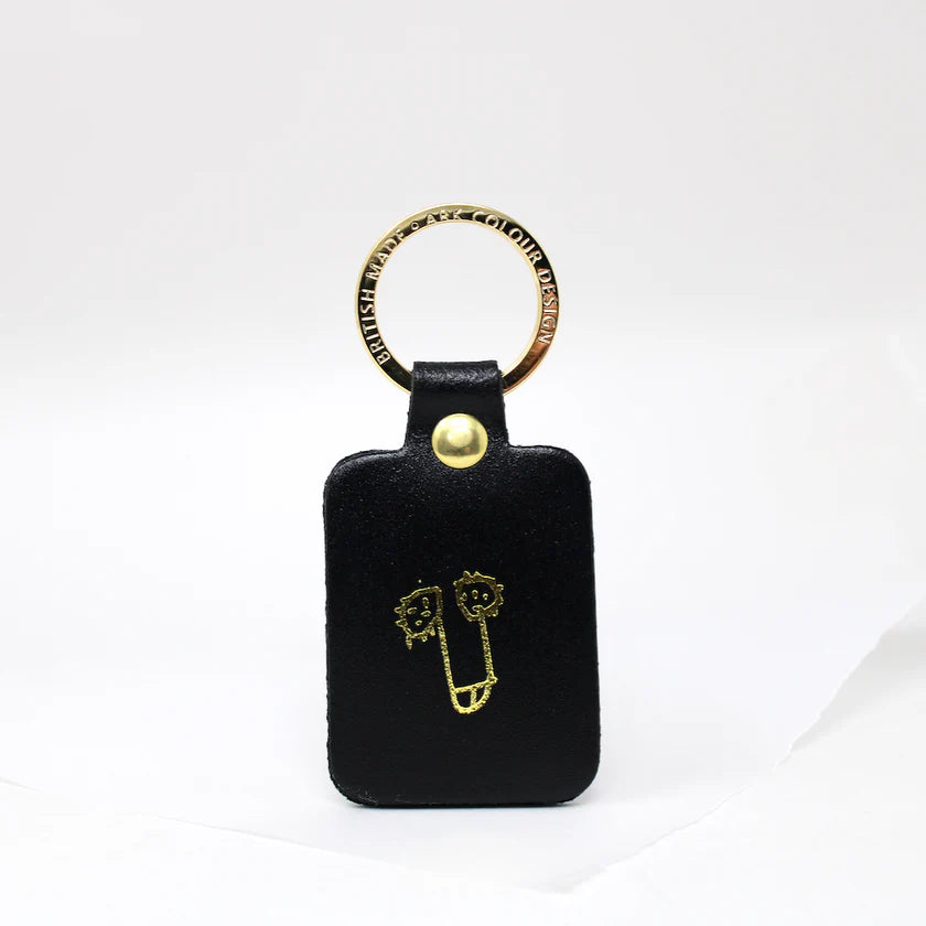 Ark black leather key fob with a gold-printed cheeky doodle