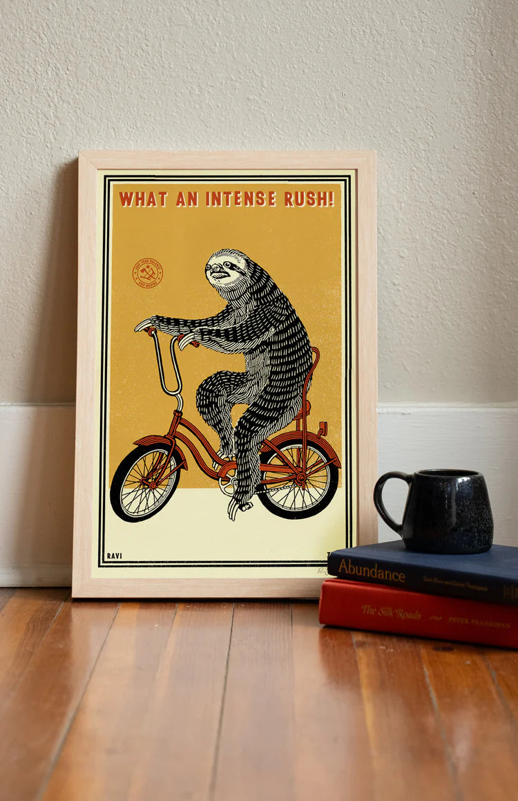 Intense Rush print in a frame on a wooden floor