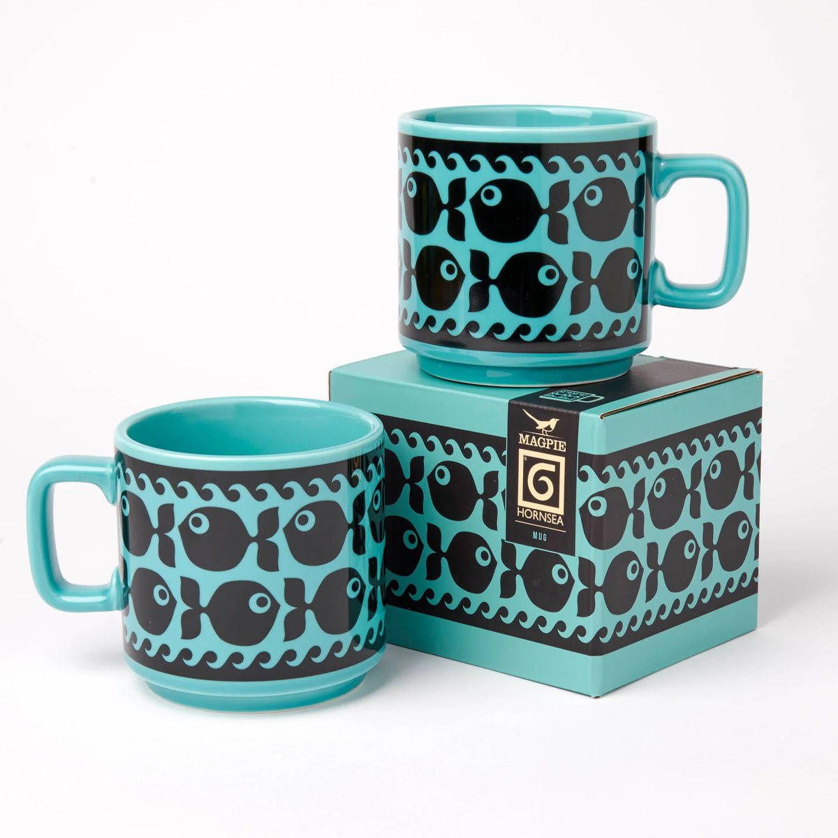 Two teal fish mugs with their gift box