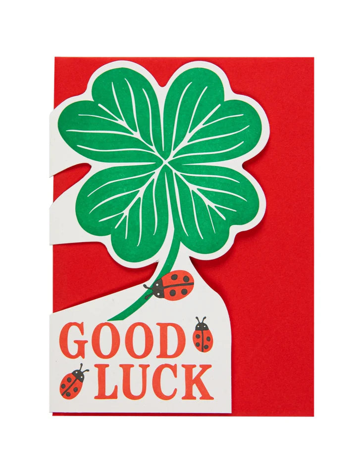 Archivist card: a green four-leaf clover with ladybirds, with 'Good luck' on red