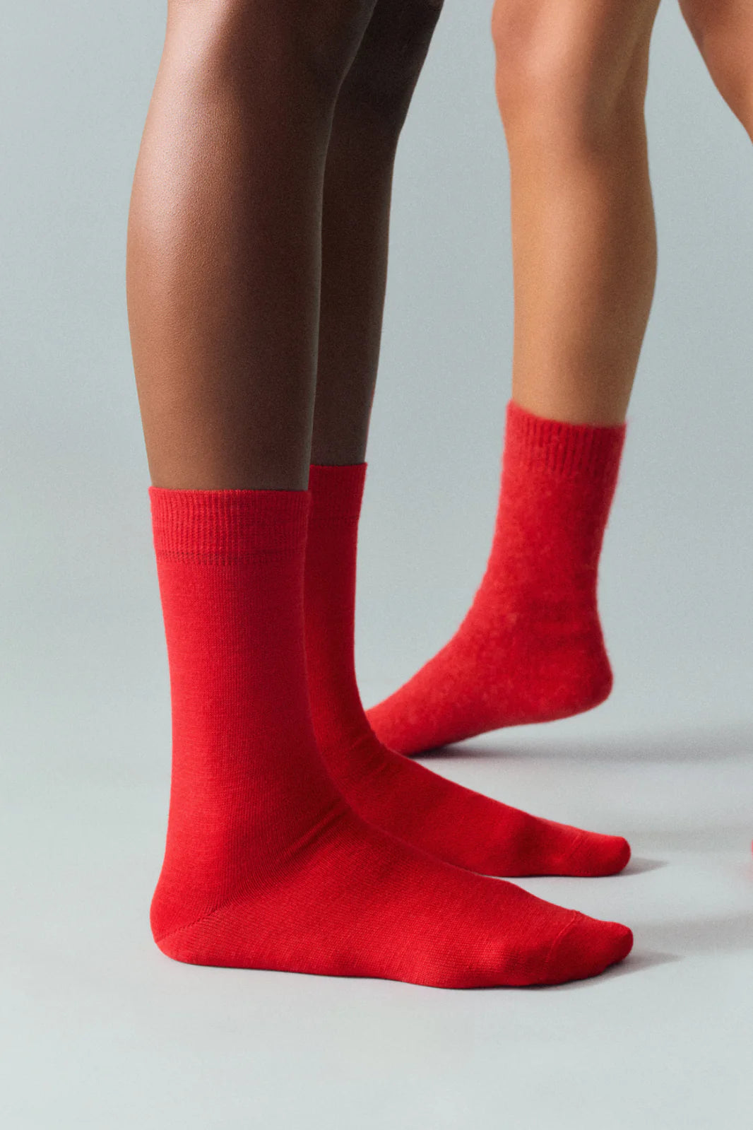 Person wearing the red calf-length socks