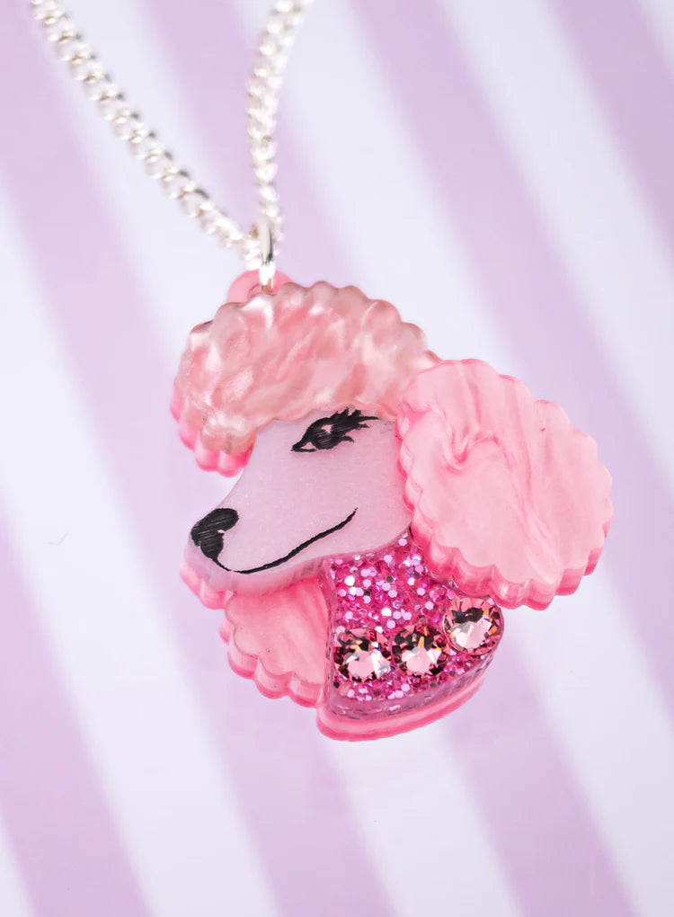 Pink poodle pendant on a pink striped background