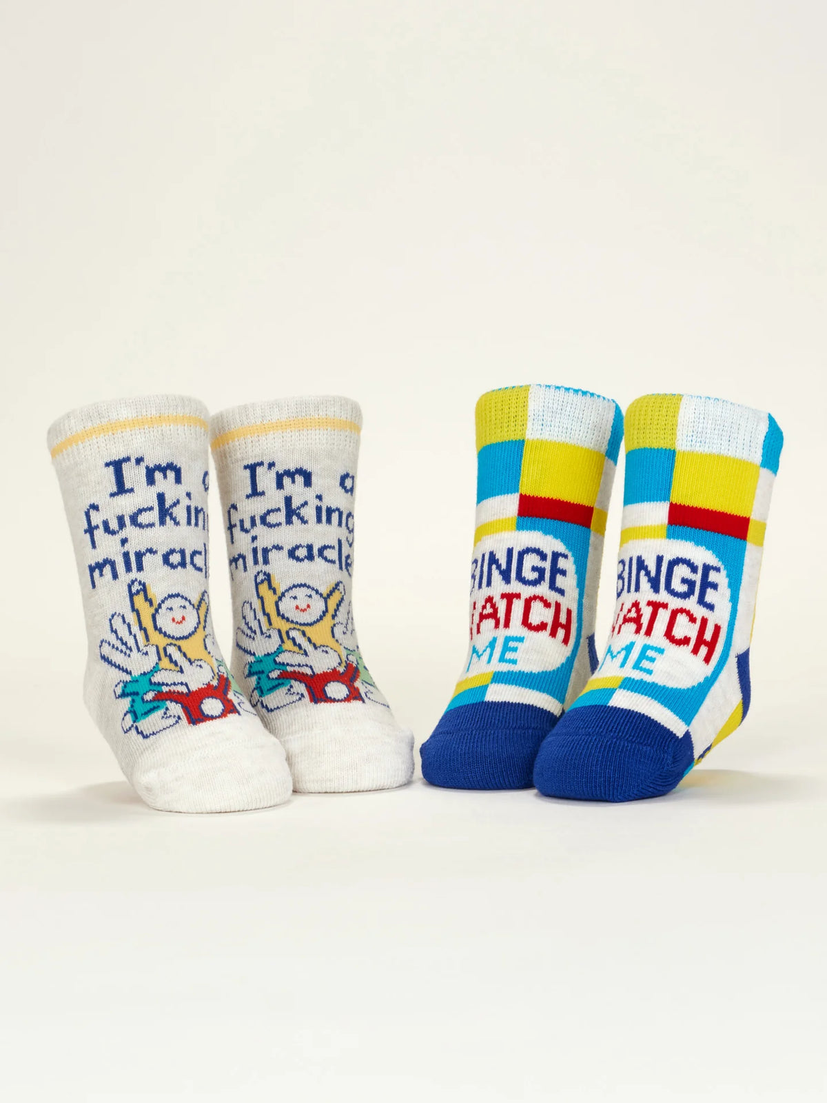 Miracle and Binge Watch baby socks standing up