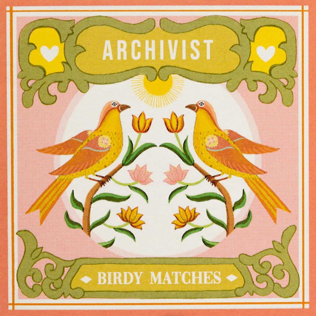 Archivist Birdy matches by Ariane: two yellow birds among tulips, with 'Birdy matches'