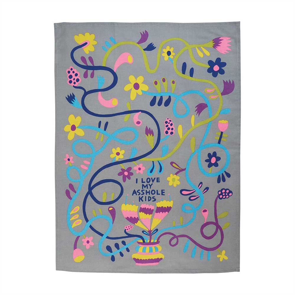 Unfolded tea towel with swirling flowers and 'I love my asshole kids'