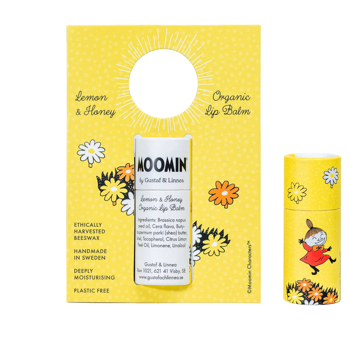 Little My organic lemon and honey lip balm on its yellow card, beside its tube