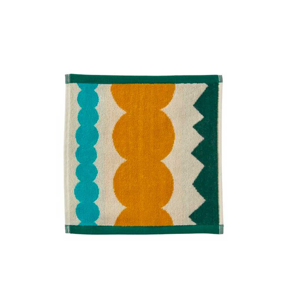 Face cloth with teal and mustard bobble shapes and a green zigzag border