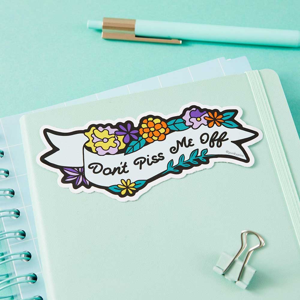 Floral banner sticker on a notebook: Don't piss me off