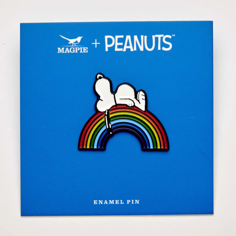 Snoopy rainbow pin on its blue Magpie x Peanuts backing card