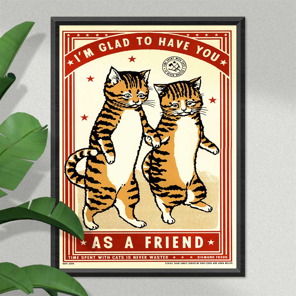 Friend print in a black frame beside a plant