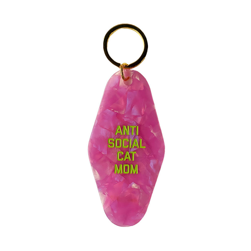 Golden Gems pink motel-style key tag reading 'Anti social cat mom'