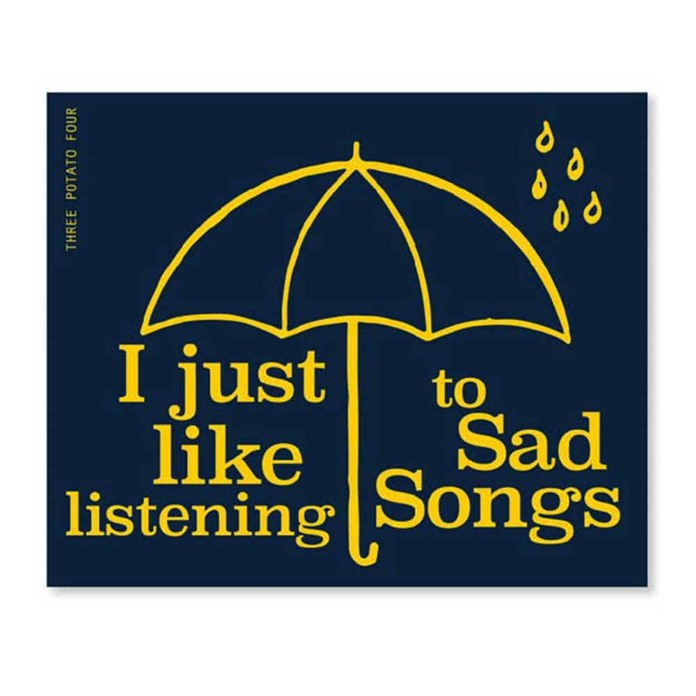 Three Potato Four sticker: a yellow umbrella and raindrops on navy, with 'I just like listening to sad songs'