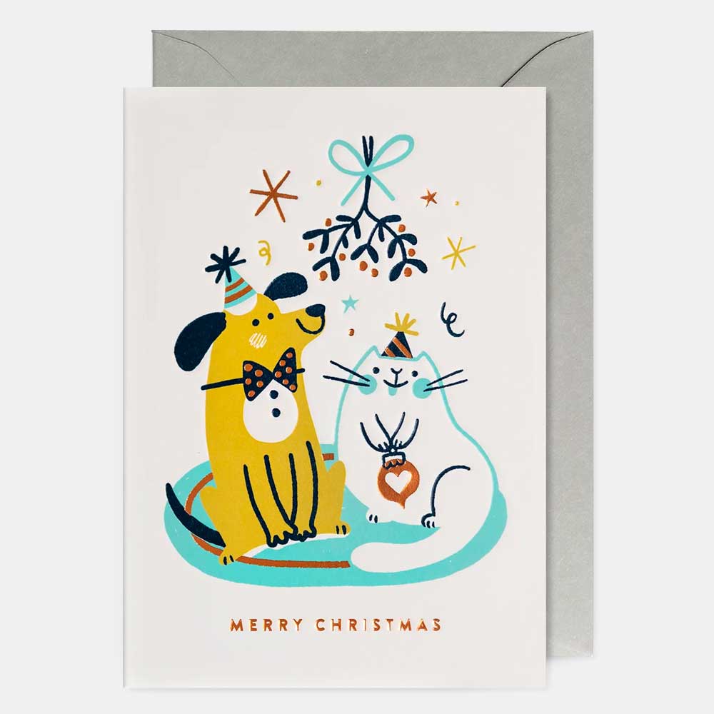 White card with a dog and cat under mistletoe: Merry Christmas