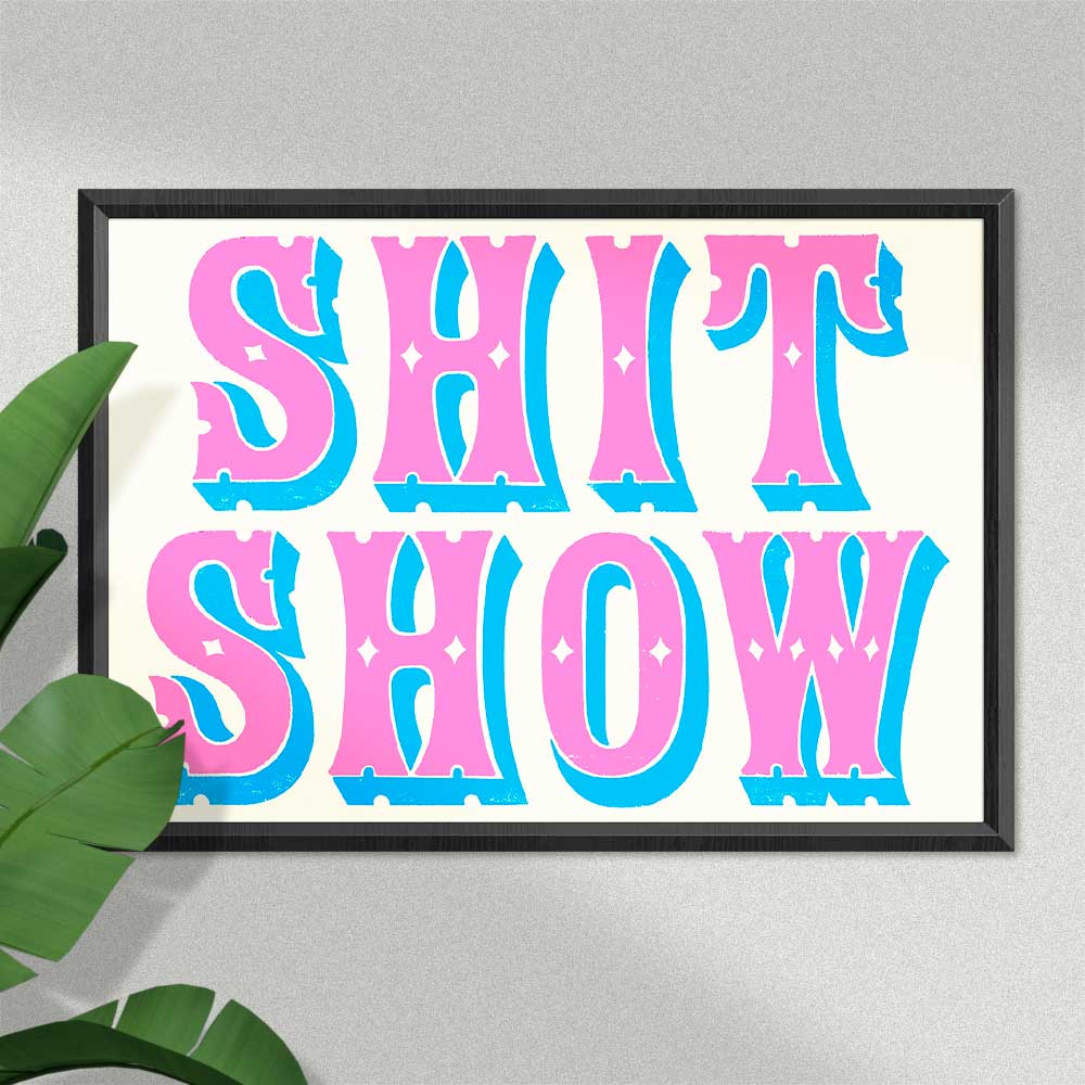 Framed risograph print in pink and blue circus lettering: Shit show