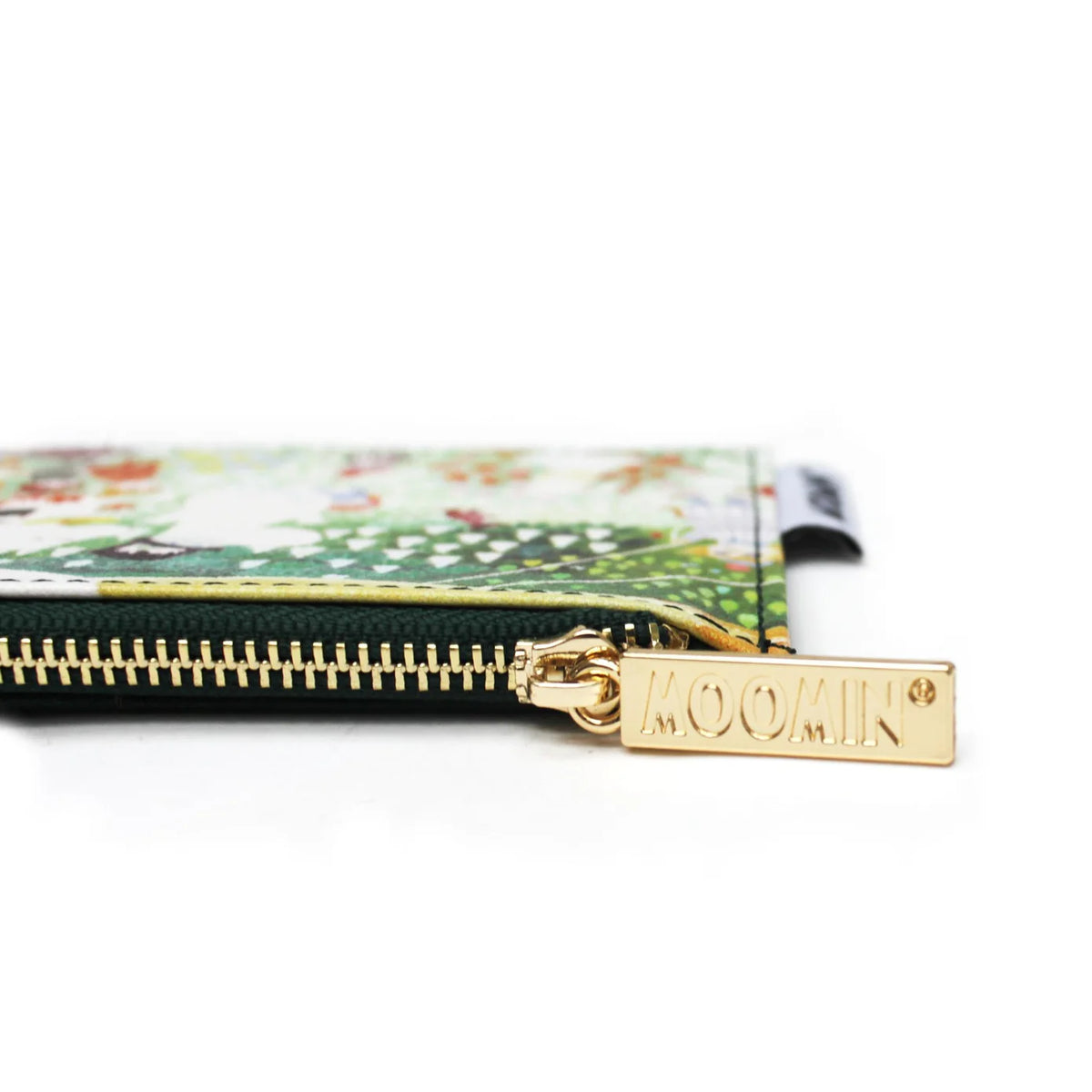Close-up of the gold Moomin zip pull