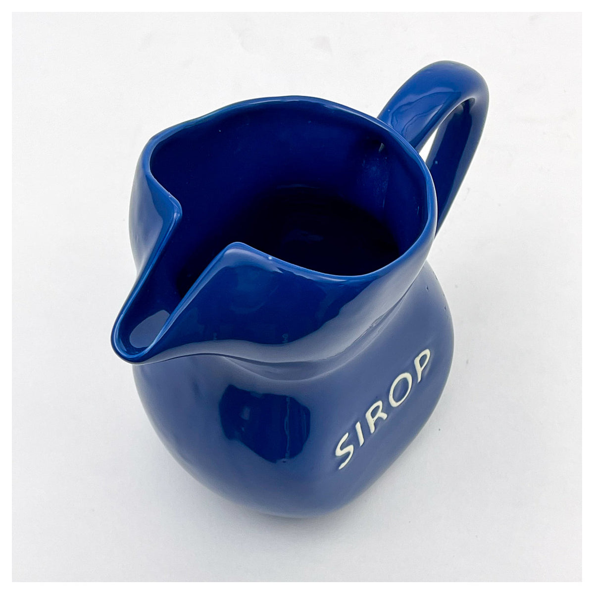 Blue Sirop jug from above, showing its pinched spout