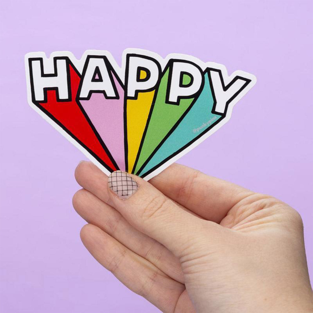 Hand holding a rainbow 3D lettered sticker: Happy