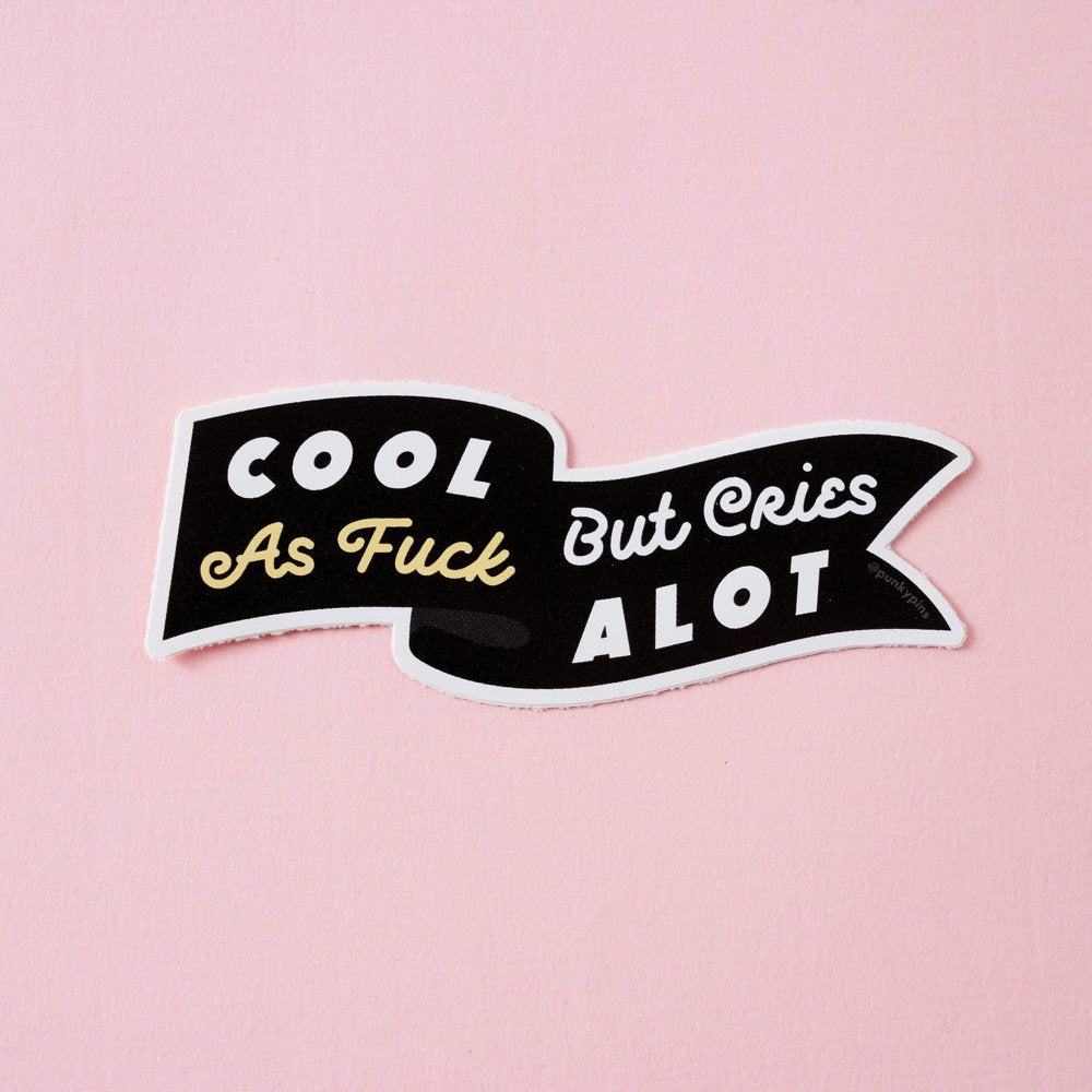 Black banner sticker: Cool as fuck but cries alot