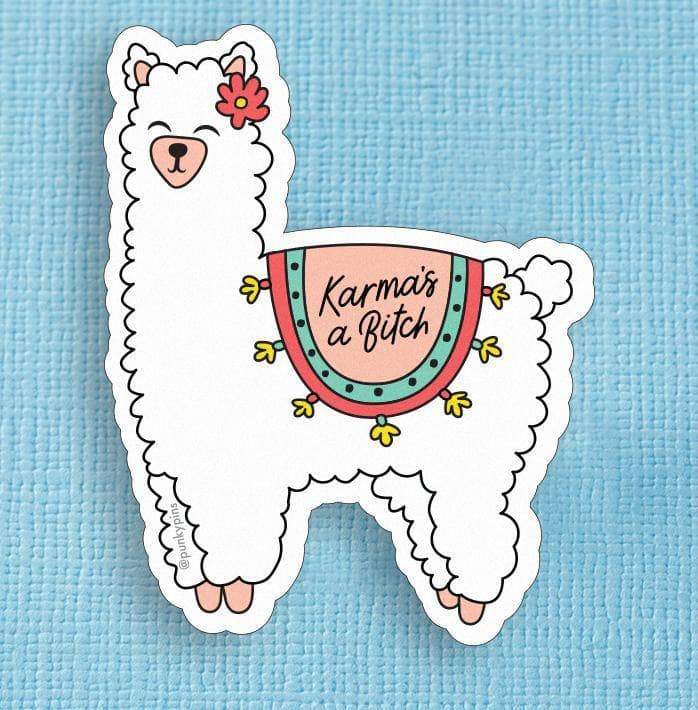 White llama sticker with a pink and teal saddle blanket: Karma's a bitch