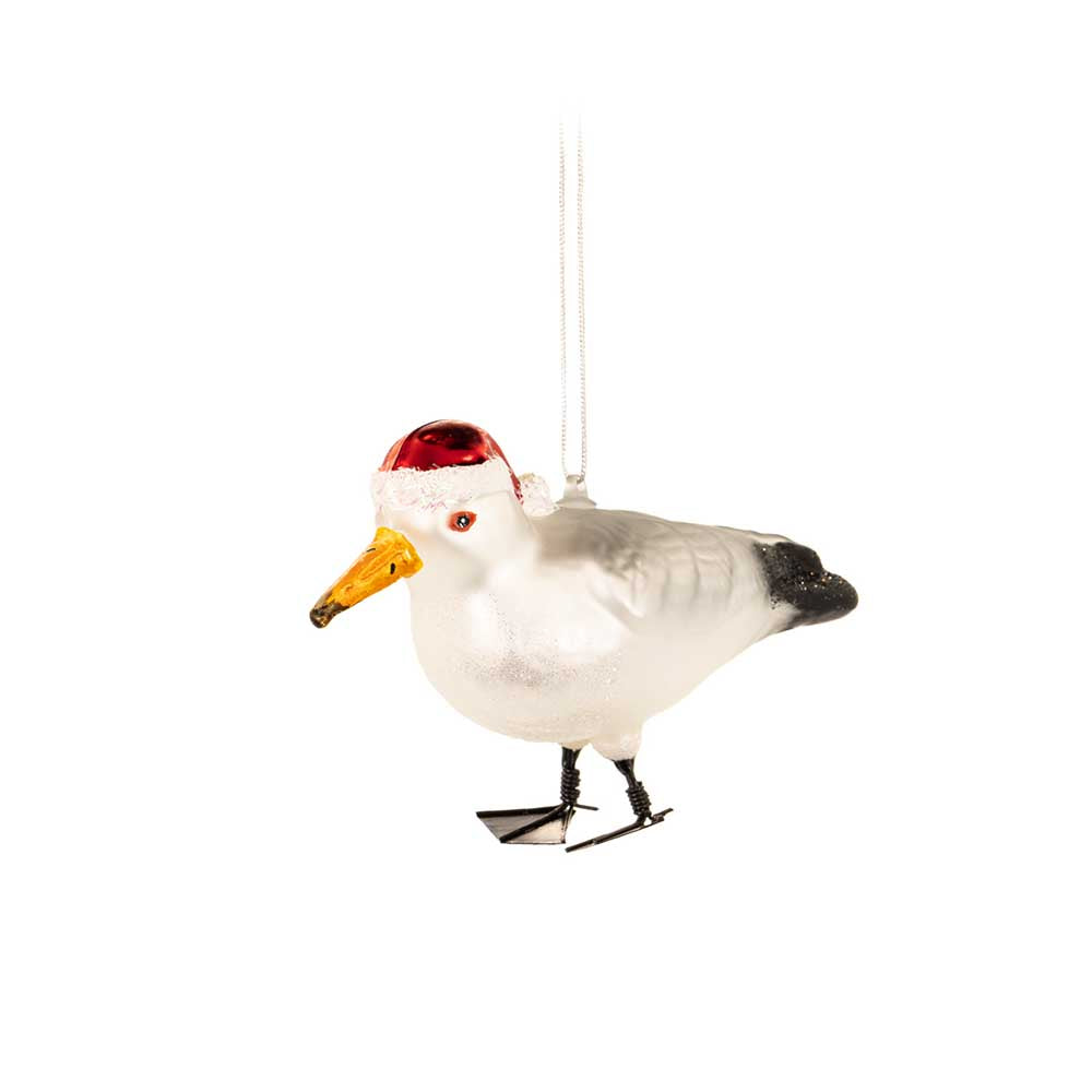 Glass Christmas bauble shaped like a seagull in a red hat