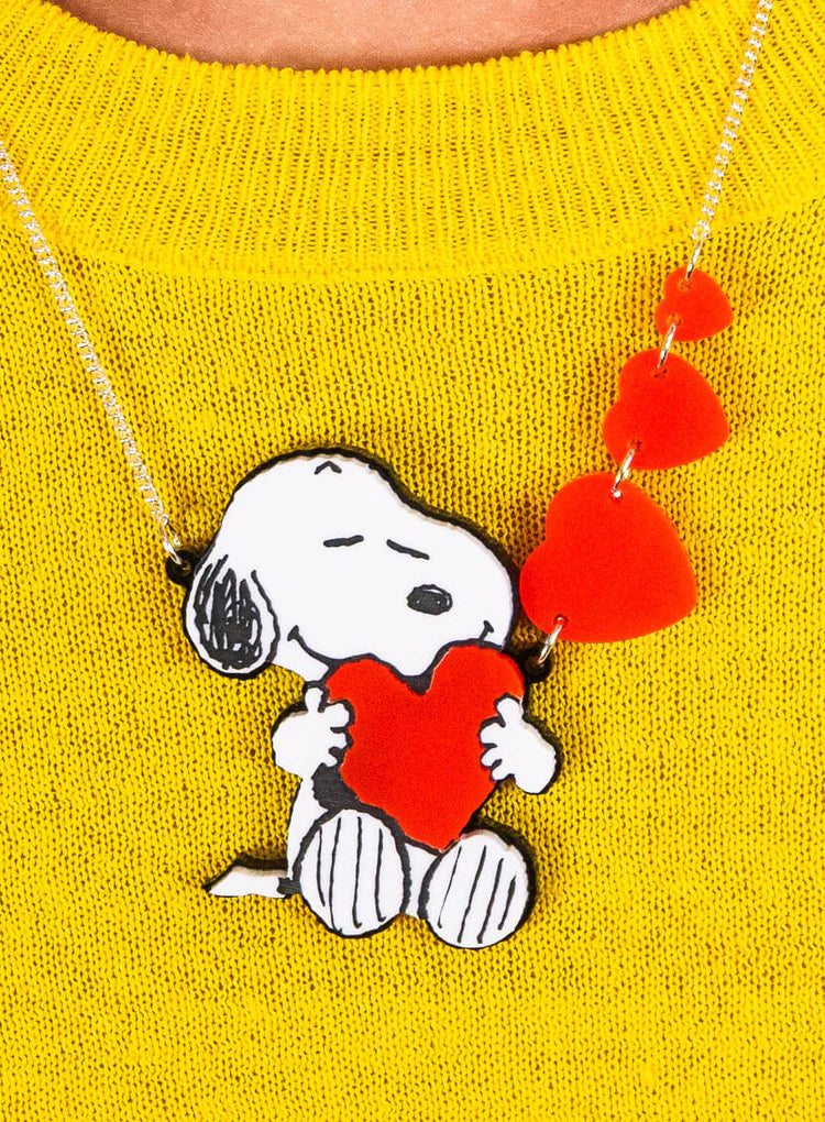 Snoopy love heart necklace on a yellow jumper