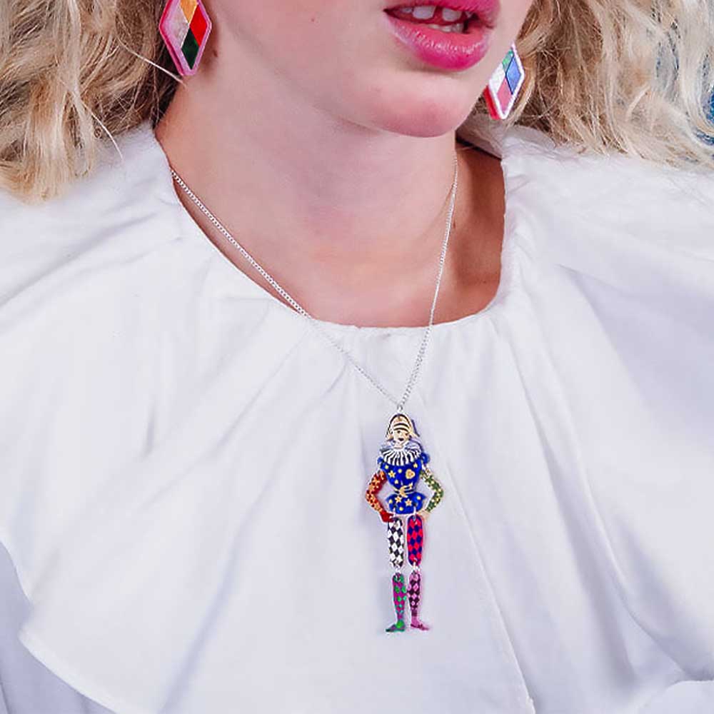 Woman wearing the harlequin pendant and earrings