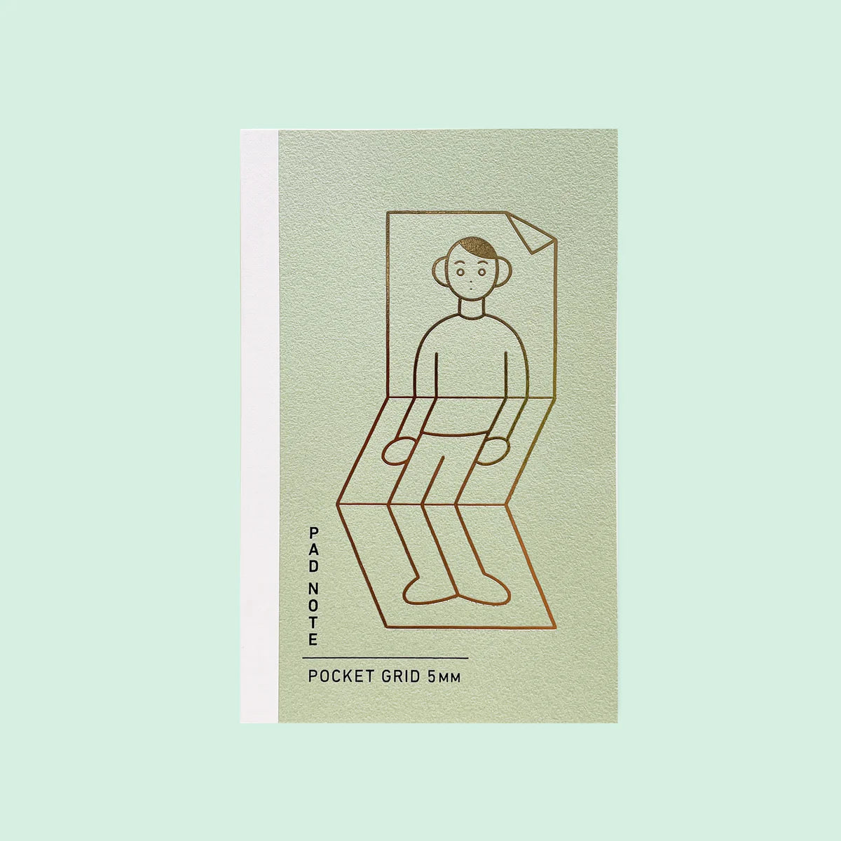 Sikigu sage green A6 notebook with a line drawing of a man folding into a chair