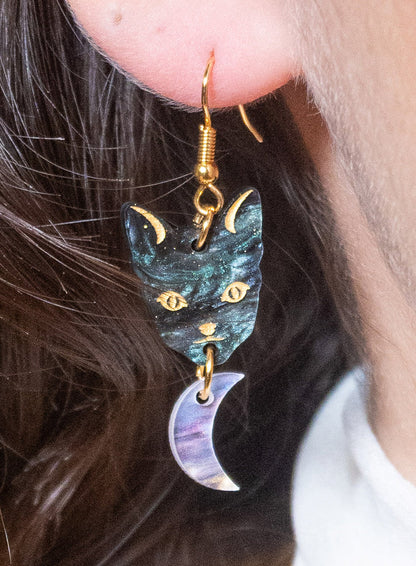 Astrologer's Cat earring with a moon, worn