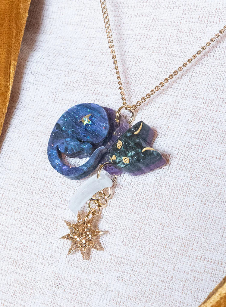 Astrologer's Cat necklace on white fabric