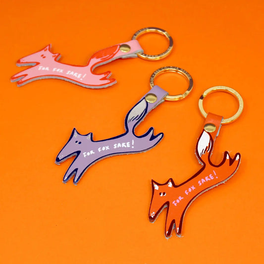 Ark 'For fox sake' key rings: leather fox shapes in pink, lilac and orange on an orange background