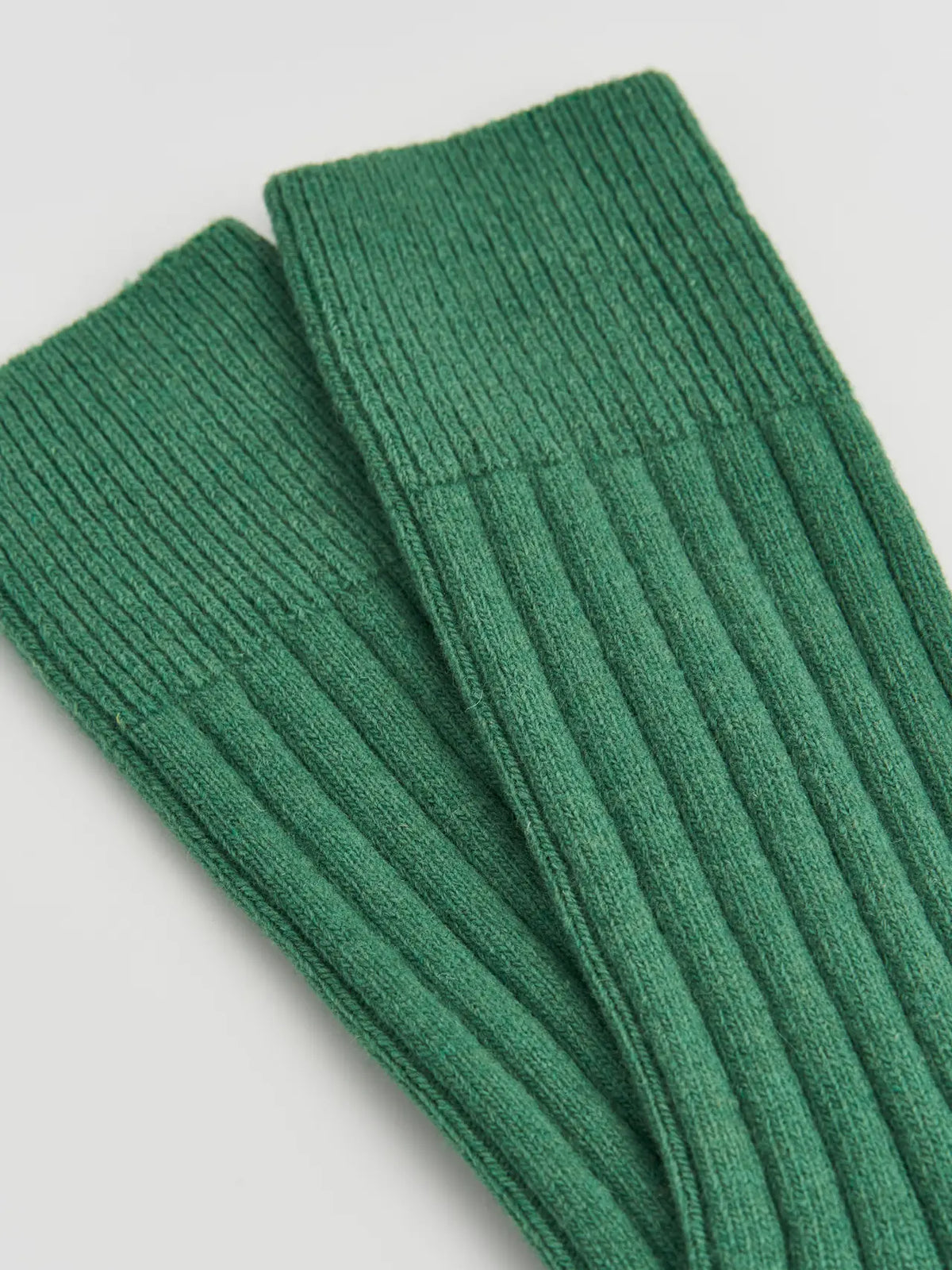 Close-up of the ribbed village green merino knit