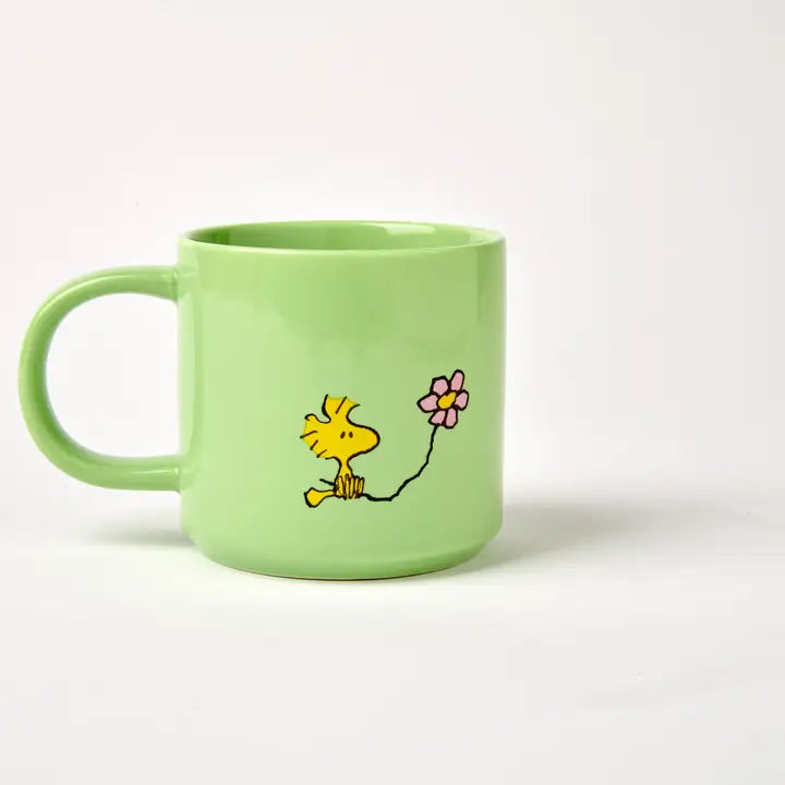 Back of the Posy mug with Woodstock holding a flower