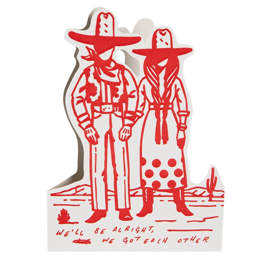Archivist cut-out card in red and white: a cowboy and cowgirl standing together, with 'We'll be alright, we got each other'