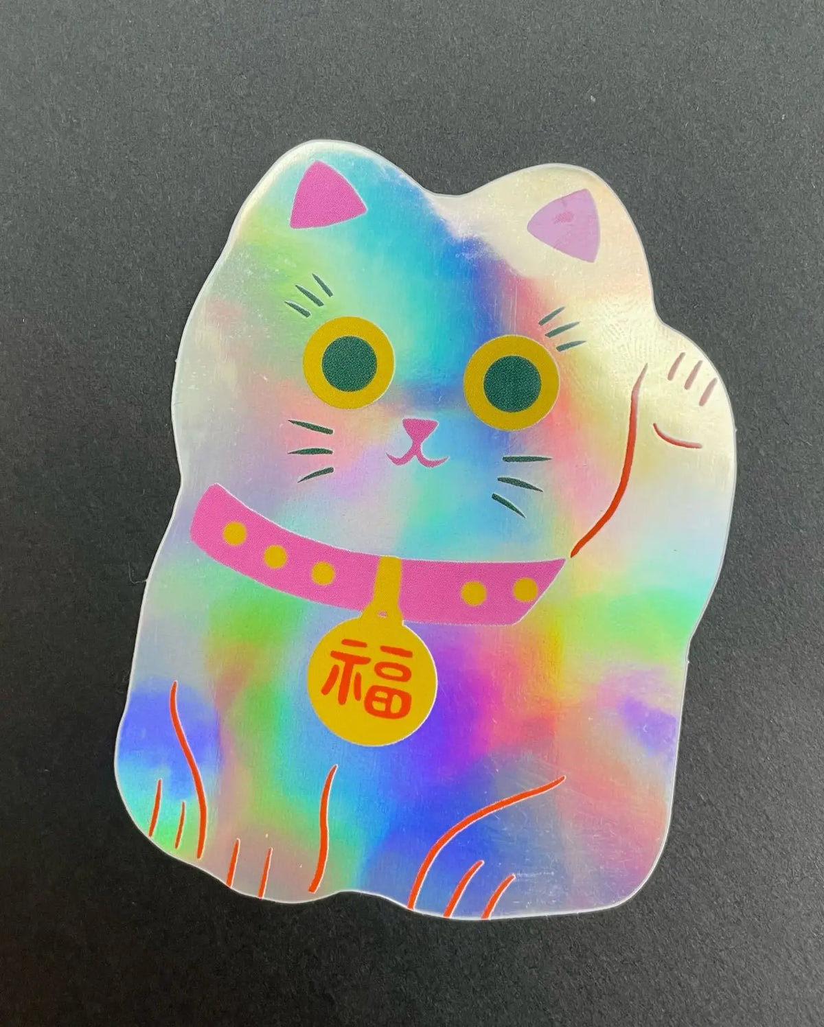 Naomi Wilkinson holographic lucky cat sticker with a pink collar and gold coin