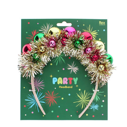 Party headband with tinsel and shiny baubles on its green card
