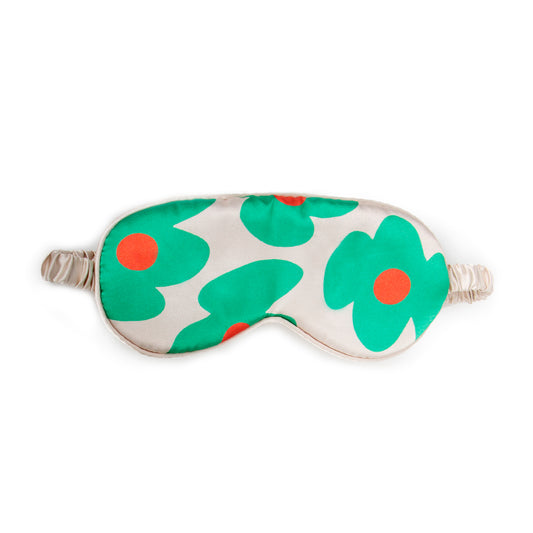 Helio Ferretti sleep mask with green and orange flowers on cream