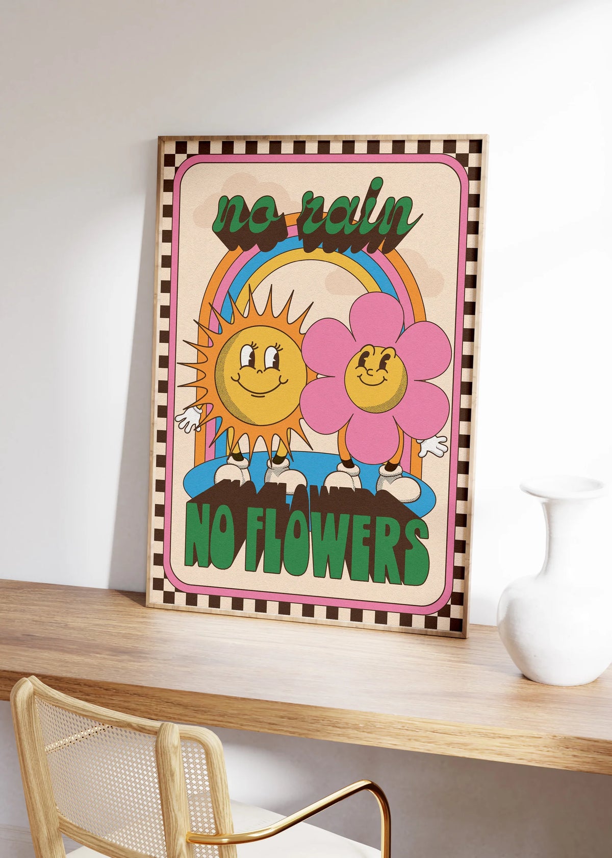 No rain no flowers print on a desk