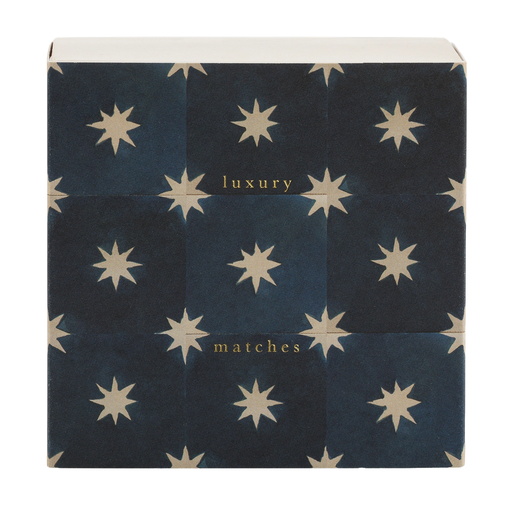 Square box of luxury matches with cream stars on navy tiles