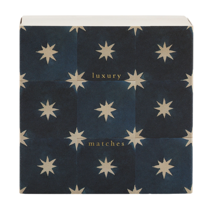 Square box of luxury matches with cream stars on navy tiles
