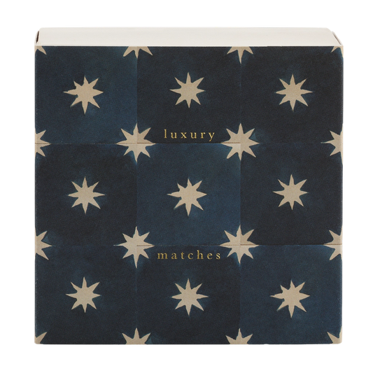Square box of luxury matches with cream stars on navy tiles